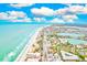 Coastal aerial view showing beach, ocean, and residential buildings at 16308 Gulf Blvd # 303, Redington Beach, FL 33708