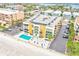 Aerial view of building, pool, parking, and beach at 16308 Gulf Blvd # 303, Redington Beach, FL 33708