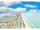 Aerial view showcasing coastline, road, and residential areas at 16308 Gulf Blvd # 303, Redington Beach, FL 33708