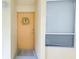 Condo entry with light walls and a wreath at 16308 Gulf Blvd # 303, Redington Beach, FL 33708