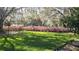 Landscaped backyard with lush greenery at 20735 Gardenia Dr, Land O Lakes, FL 34638