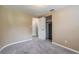 Bedroom with beige walls, carpet, and a safe in the closet at 20735 Gardenia Dr, Land O Lakes, FL 34638