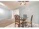 Small dining area with glass-top table and four chairs at 20735 Gardenia Dr, Land O Lakes, FL 34638