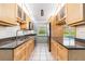 Kitchen with light wood cabinets and granite counters at 20735 Gardenia Dr, Land O Lakes, FL 34638