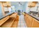 Bright kitchen with light wood cabinets, granite counters, and ample drawer space at 20735 Gardenia Dr, Land O Lakes, FL 34638