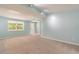 Bright living room with light blue walls and carpet at 20735 Gardenia Dr, Land O Lakes, FL 34638