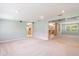Bright and airy living room, open to the kitchen at 20735 Gardenia Dr, Land O Lakes, FL 34638