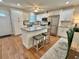 Modern kitchen with island, stainless steel appliances, and white cabinets at 2254 Norwegian Dr # 2, Clearwater, FL 33763