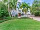 Two-story home with lush landscaping and a manicured lawn at 334 Blanca Ave, Tampa, FL 33606