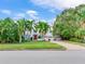 White two-story house with palm trees and a brick driveway at 334 Blanca Ave, Tampa, FL 33606