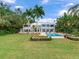 Inviting backyard oasis featuring a pool, spa, and lush landscaping at 334 Blanca Ave, Tampa, FL 33606