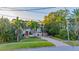 Charming two-story home with lush landscaping and brick driveway at 334 Blanca Ave, Tampa, FL 33606