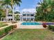 Backyard pool with lush landscaping, perfect for outdoor entertaining at 334 Blanca Ave, Tampa, FL 33606