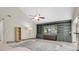 Living room featuring built-in shelving and a view to the pool at 3412 Reynoldswood Dr, Tampa, FL 33618