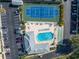Aerial view of community pool, tennis courts, shuffleboard, and parking at 3515 41St S Ter # 221, St Petersburg, FL 33711