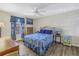Main bedroom with a queen bed, dresser, and ceiling fan at 3515 41St S Ter # 221, St Petersburg, FL 33711