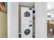 Stackable washer and dryer in a closet with white louvered doors at 3515 41St S Ter # 221, St Petersburg, FL 33711