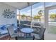 Screened patio with table and chairs, overlooking the pool at 3515 41St S Ter # 221, St Petersburg, FL 33711