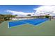 Well-maintained tennis court with green and blue surface at 3515 41St S Ter # 221, St Petersburg, FL 33711