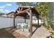 Covered patio with sectional sofa and string lights at 3804 N Arlington Ave, Tampa, FL 33603