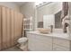 Clean bathroom with white vanity and stone sink at 3804 N Arlington Ave, Tampa, FL 33603