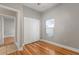 Light-filled bedroom with hardwood floors and double door closet at 3804 N Arlington Ave, Tampa, FL 33603
