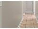 Clean hallway with tile flooring and neutral walls at 3804 N Arlington Ave, Tampa, FL 33603