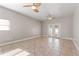 Large living room with tile floors and access to a patio at 3804 N Arlington Ave, Tampa, FL 33603