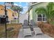 Relaxing patio with two chairs and footrests at 3804 N Arlington Ave, Tampa, FL 33603