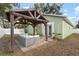 Outdoor patio with covered pergola and seating at 3804 N Arlington Ave, Tampa, FL 33603