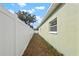 Side yard with privacy fence and gravel ground at 3804 N Arlington Ave, Tampa, FL 33603