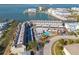 Complex with waterfront views, pool, and covered parking at 433 S Paula Dr # 32, Dunedin, FL 34698