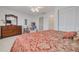 Bedroom featuring wooden furniture, a ceiling fan, and closet space at 433 S Paula Dr # 32, Dunedin, FL 34698
