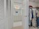 Walk-in closet with ample storage space and access to the bathroom at 433 S Paula Dr # 32, Dunedin, FL 34698