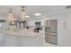 Well-lit kitchen featuring stainless steel appliances and a marble island at 433 S Paula Dr # 32, Dunedin, FL 34698