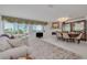 Spacious living room boasts water views, stylish furnishings, and elegant decor at 433 S Paula Dr # 32, Dunedin, FL 34698