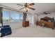 Spacious main bedroom with ornate furniture, ceiling fan, and expansive water view at 433 S Paula Dr # 32, Dunedin, FL 34698