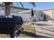 Outdoor patio with grill, table and chairs, and umbrella at 433 S Paula Dr # 32, Dunedin, FL 34698