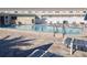 Community pool with lounge chairs surrounding the pool at 433 S Paula Dr # 32, Dunedin, FL 34698