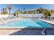 Community pool featuring a pool deck with plenty of seating at 433 S Paula Dr # 32, Dunedin, FL 34698