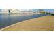 Scenic waterfront view featuring a community building and dock, blending residential and recreational amenities at 433 S Paula Dr # 32, Dunedin, FL 34698