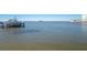 Boat docked on serene water with clear skies at 433 S Paula Dr # 32, Dunedin, FL 34698
