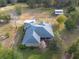 Aerial view of a house with a screened porch and barn at 4347 Eva Lou Dr, Brooksville, FL 34602