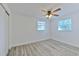 Spacious bedroom featuring ceiling fan and vinyl plank flooring at 4545 W Hanna Ave, Tampa, FL 33614