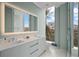 Modern bathroom with a large mirror and double vanity at 5120 Marina Way # 112, Tampa, FL 33611