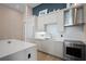 Modern kitchen with light wood cabinets and stainless steel appliances at 5120 Marina Way # 112, Tampa, FL 33611