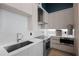 Modern kitchen with light wood cabinets and stainless steel appliances at 5120 Marina Way # 112, Tampa, FL 33611