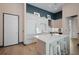 Modern kitchen with light wood cabinets and stainless steel appliances at 5120 Marina Way # 112, Tampa, FL 33611