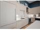 Modern kitchen with light wood cabinets and stainless steel appliances at 5120 Marina Way # 112, Tampa, FL 33611