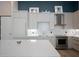 Modern kitchen with light wood cabinets and stainless steel appliances at 5120 Marina Way # 112, Tampa, FL 33611